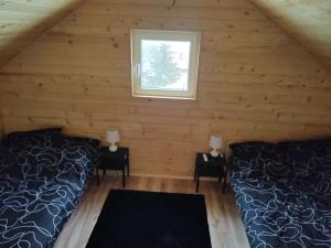 Fotografia z galérie ubytovania Domek całoroczny pod sosenką v destinácii Łapanów