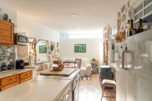 a kitchen with a refrigerator and a living room at Growth House in Porto +82 photos