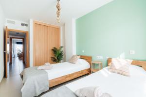 Ένα ή περισσότερα κρεβάτια σε δωμάτιο στο Apartamento primera linea de Playa Serena