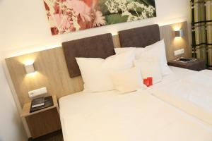 Postel nebo postele na pokoji v ubytování Central Hotel Eschborn