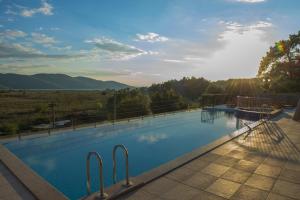 a large swimming pool with a view of the mountains at Hotel Lotus Spa&Sport Akyaka in Akyaka