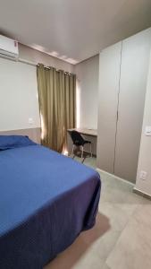 Un pat sau paturi într-o cameră la Apartamento Sossego
