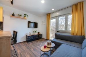 a living room with a couch and a table at Apartment Niksa in Pula
