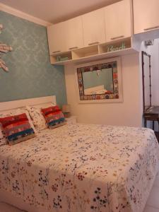 a bedroom with a bed and a mirror at Linda Casa Condomínio Maresias in Maresias +54 photos