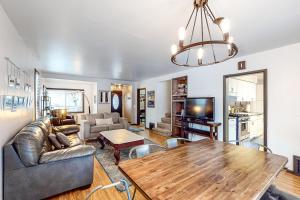 a living room with a table and a couch at The Perfect Sandpoint Rental in Sandpoint