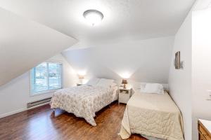 a bedroom with two beds and a window at The Perfect Sandpoint Rental in Sandpoint