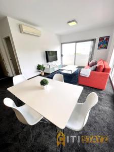 a living room with a white table and chairs at Bold in Bruce - 1bd 1bth 1csp in Belconnen