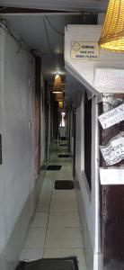 an empty hallway of a building with mats on the floor at Pousadinha da Liza in Mangaratiba
