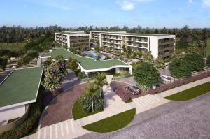 - une vue aérienne sur un complexe avec une piscine et des bâtiments dans l'établissement Mana Beach Resort Muro Alto Prime - Porto de Galinhas, à Porto de Galinhas