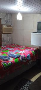 En eller flere senge i et værelse på Pousadinha da Liza