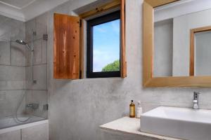 a bathroom with a sink and a mirror and a tub at Monte “SERRA E MAR” in Melides +27 photos