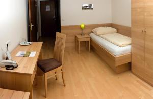 Postel nebo postele na pokoji v ubytování Kurhotel Bad Zell