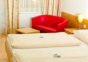 Postel nebo postele na pokoji v ubytování Kurhotel Bad Zell