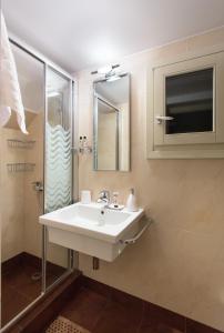 a bathroom with a sink and a shower at Villa Itis Superb Residence with Balcony & Panoramic View in Neapoli Voion