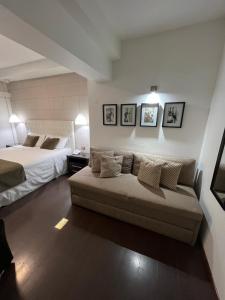 Postel nebo postele na pokoji v ubytování Hotel Alvear