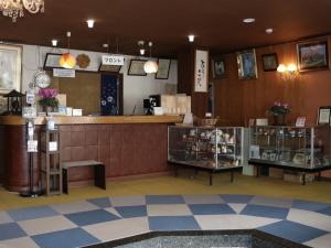 a lobby of a store with a counter at Hotel Suehiro in Matsumoto