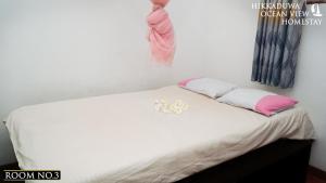 Voodi või voodid majutusasutuse Hikkaduwa Ocean View Homestay toas