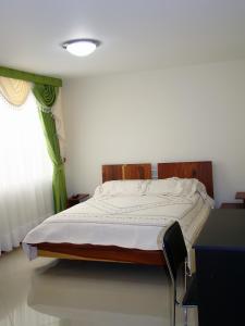 Voodi või voodid majutusasutuse Apartahotel Vincent Suites toas
