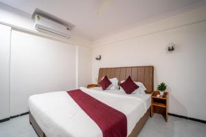 Ένα ή περισσότερα κρεβάτια σε δωμάτιο στο Hotel Kewal