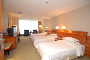 Televiisor ja/või meelelahutuskeskus majutusasutuses Yihe Hotel Ouzhuang