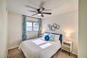 a bedroom with a bed and a ceiling fan at Spacious Riverside Home with Game Room and Yard in Riverside