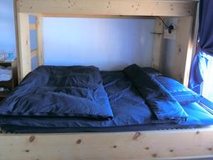 Postel nebo postele na pokoji v ubytování Shirokuma Inn