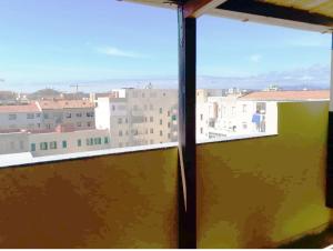a view of a city from a window at Satta 81 in Alghero
