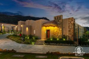 a rendering of a villa at night at Shalalat Al Ghaba Chalets in Taif