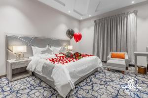 a bedroom with a large bed with a balloon on it at شاليهات شلالات الغابة in Taif