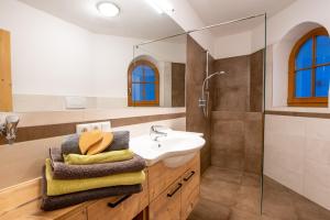 a bathroom with a sink and a shower at Patztauhof in Sluderno