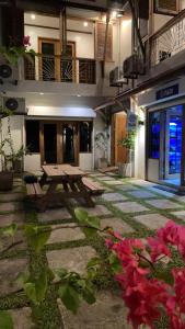 a patio with a picnic table in a building at P&B Residences Legazpi in Legazpi