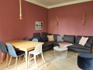 a living room with a couch and a table at Gut Boltenhof in Fürstenberg-Havel