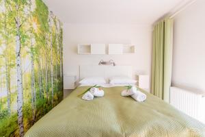 Posteľ alebo postele v izbe v ubytovaní Horyzont Apartamenty -Apartament Willa Karl- Blisko Centrum