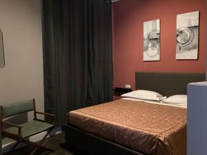A bed or beds in a room at Hotel Calypso