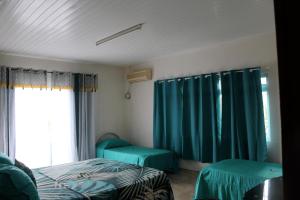 A bed or beds in a room at HIME LODGE Még 29 kép