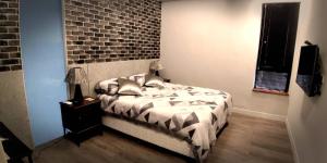 Ένα ή περισσότερα κρεβάτια σε δωμάτιο στο Mudan Gathering Homestay