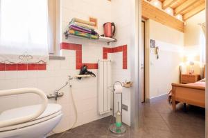 a bathroom with a toilet and a sink at B&B Ambrosia in Aosta