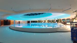 a large pool in the middle of a building at Hanza Tower Studio in Szczecin