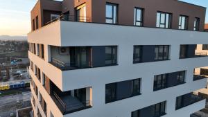 an apartment building with balconies in a city at MM Apartments Zore in Zagreb