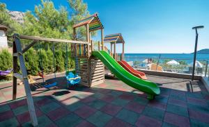 a playground with a slide at Turunc Premium Hotel in Turunç