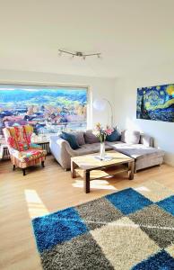 a living room with a couch and a table at Sanosueno 3 in Sonthofen