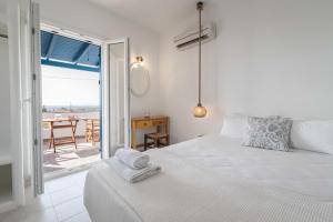 Ένα ή περισσότερα κρεβάτια σε δωμάτιο στο Manolis Studios