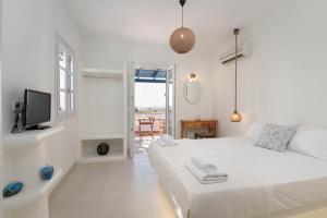 Ένα ή περισσότερα κρεβάτια σε δωμάτιο στο Manolis Studios
