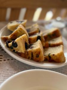 a plate of blueberry waffles on a table at Pousada Matuto Sonhador in Cabaceiras