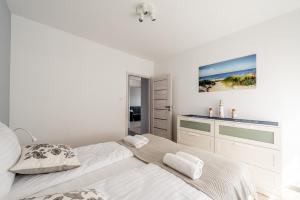 Posteľ alebo postele v izbe v ubytovaní Horyzont Apartamenty - Kapitański Mostek- BLISKO PORTU- Śniadania
