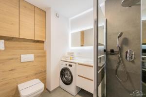 Kúpeľňa v ubytovaní Horyzont Apartamenty - Kapitański Mostek- BLISKO PORTU- Śniadania