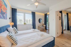 Posteľ alebo postele v izbe v ubytovaní Horyzont Apartamenty - Kapitański Mostek- BLISKO PORTU- Śniadania