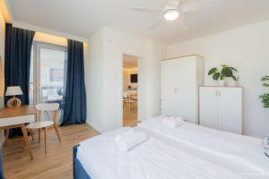 Posteľ alebo postele v izbe v ubytovaní Horyzont Apartamenty - Kapitański Mostek- BLISKO PORTU- Śniadania