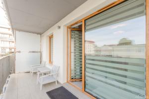 Balkón alebo terasa v ubytovaní Horyzont Apartamenty - Osiedle Bursztynowe