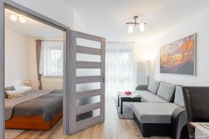 Posteľ alebo postele v izbe v ubytovaní Horyzont Apartamenty - Osiedle Bursztynowe